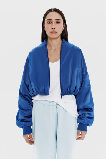 cropped satin bomber in electric blue color