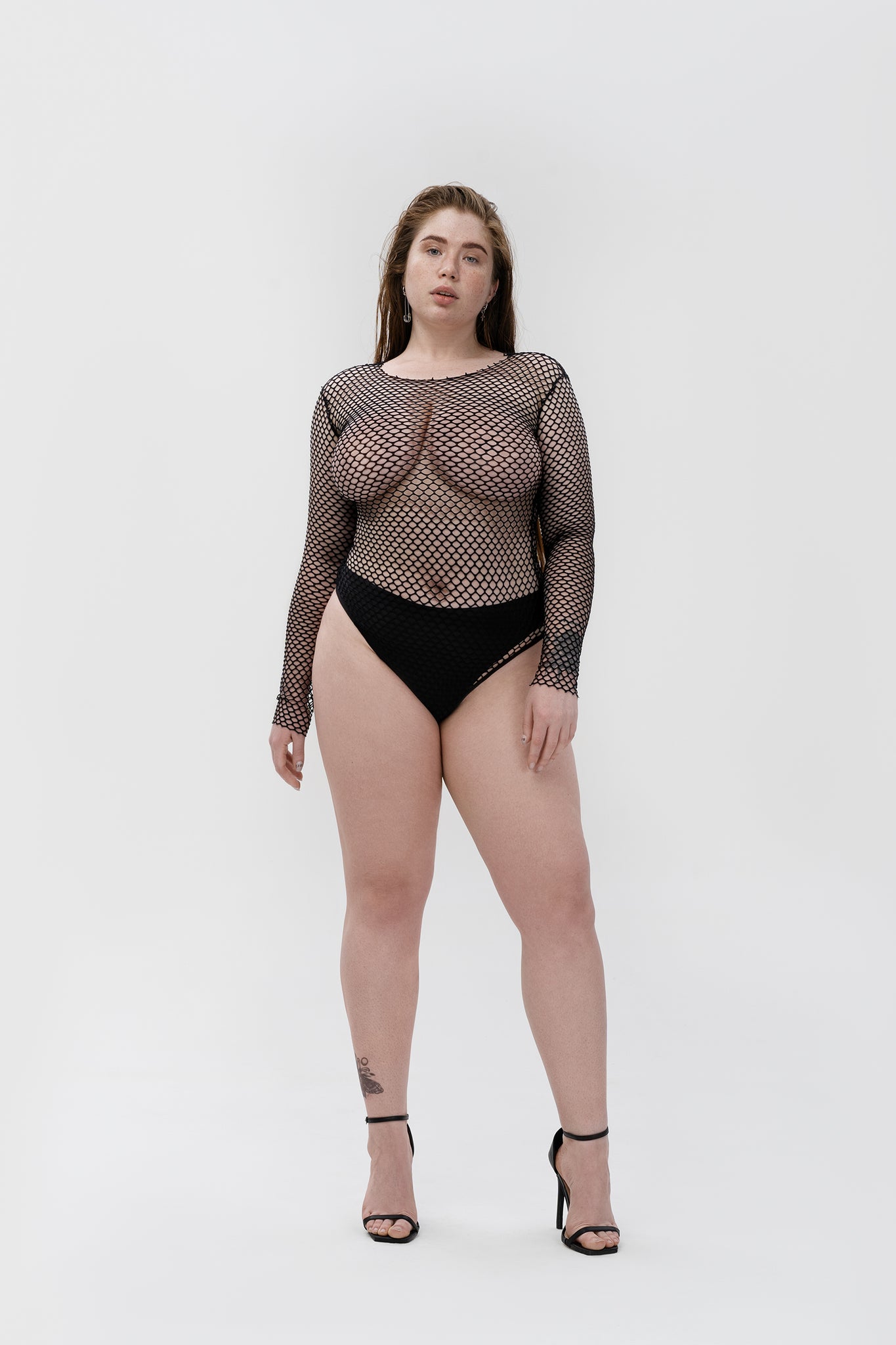 "sheer" mesh bodysuit in black color